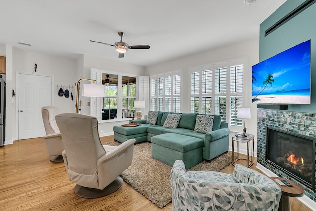 134 Etiwan Park St, Charleston, SC 29492 - living room with a ceiling fan, light wood finished floors, plenty of natural light, and a glass covered fireplace