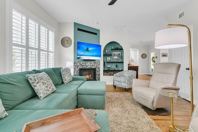 134 Etiwan Park St, Charleston, SC 29492 - living area featuring wood finished floors, a fireplace, baseboards, and a ceiling fan