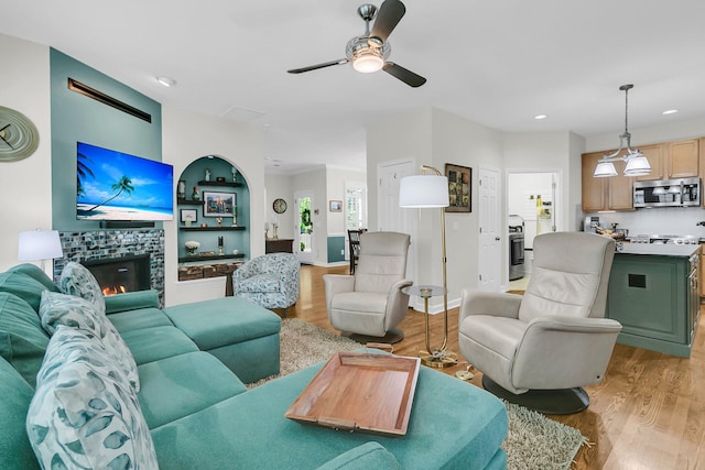 134 Etiwan Park St, Charleston, SC 29492 - living area with light wood finished floors, ceiling fan, a tile fireplace, and recessed lighting