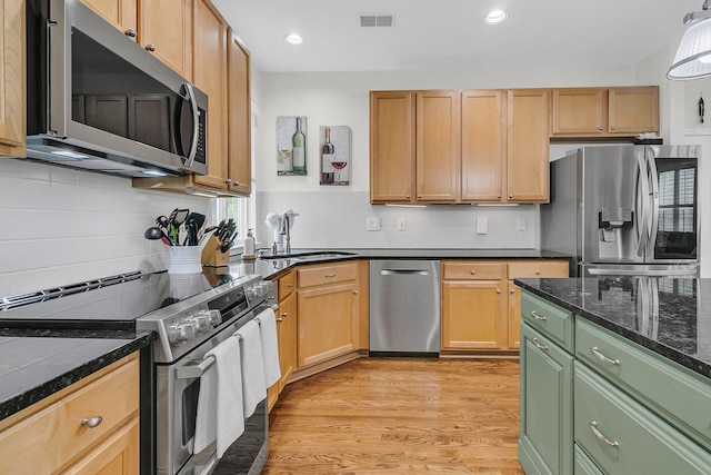 134 Etiwan Park St, Charleston, SC 29492 - kitchen with stainless steel appliances, a sink, light wood-style flooring, decorative backsplash, and recessed lighting