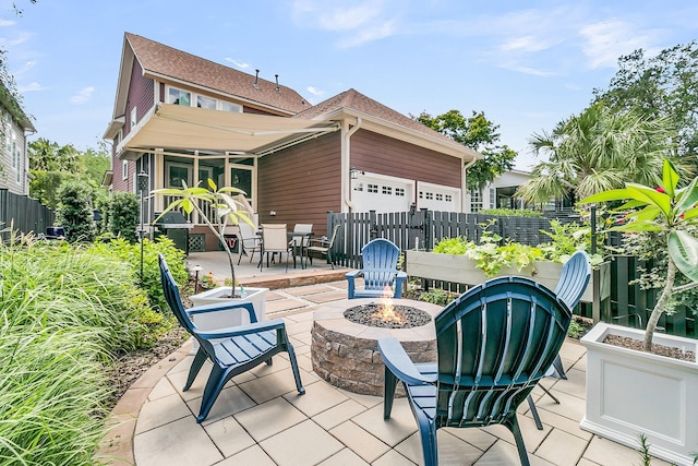 134 Etiwan Park St, Charleston, SC 29492 - view of patio / terrace with a fire pit and a garage