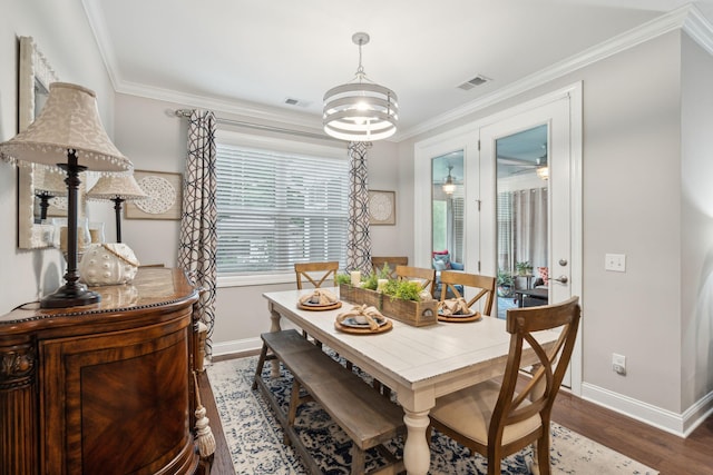 259 Camber Rd, Huger, SC 29450 - dining area featuring baseboards, ornamental molding, wood finished floors, and a chandelier