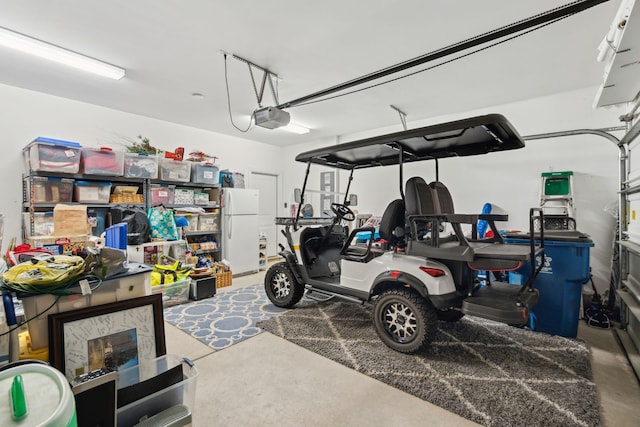 259 Camber Rd, Huger, SC 29450 - garage featuring freestanding refrigerator and a garage door opener