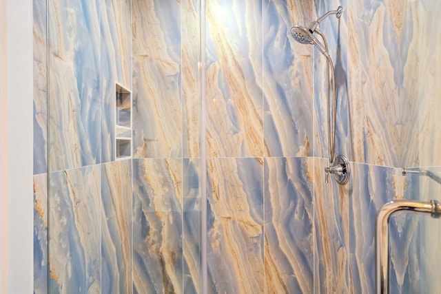 room details with a marble finish shower