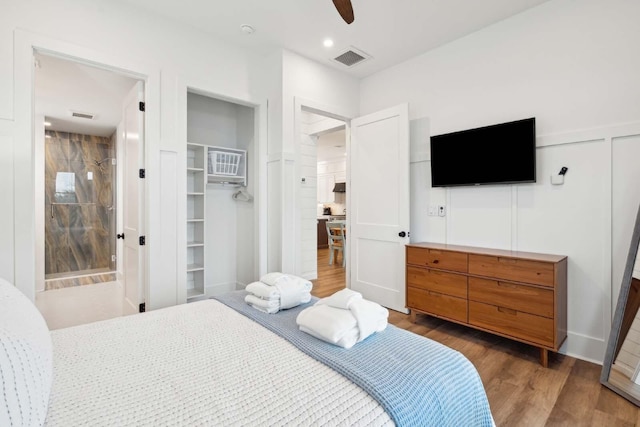 bedroom featuring a ceiling fan, recessed lighting, visible vents, and wood finished floors