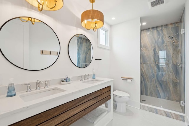 full bathroom featuring toilet, a marble finish shower, visible vents, and a sink