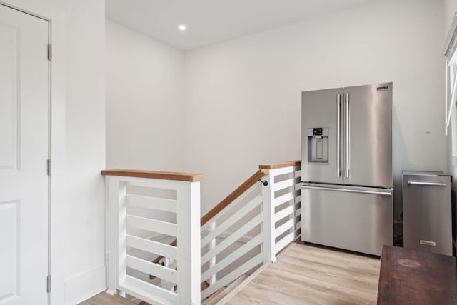 kitchen featuring light wood-style floors, recessed lighting, and stainless steel fridge with ice dispenser