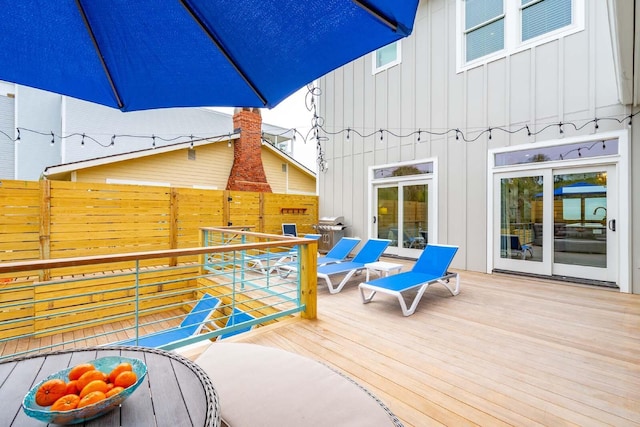 wooden deck featuring fence