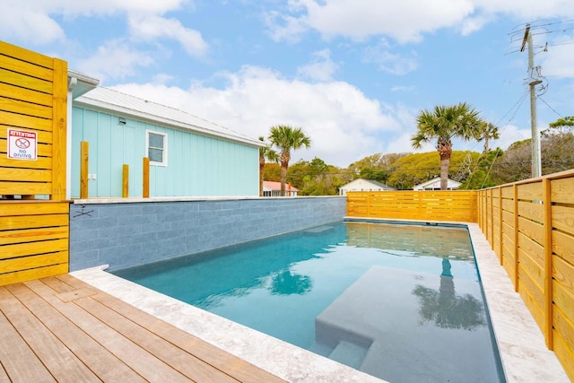 view of swimming pool featuring a fenced backyard and a fenced in pool