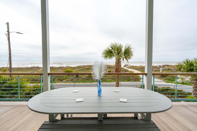 wooden terrace featuring outdoor dining area