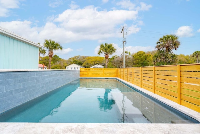 view of pool featuring fence