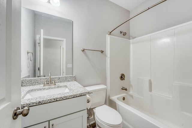 bathroom with washtub / shower combination, toilet, and vanity