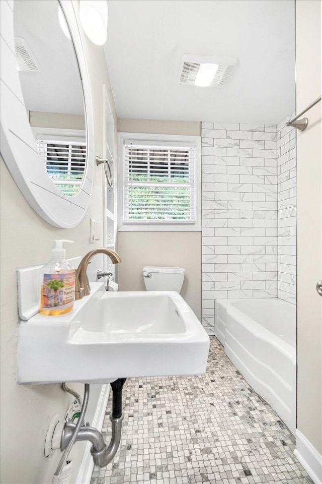 full bathroom with toilet and  shower combination