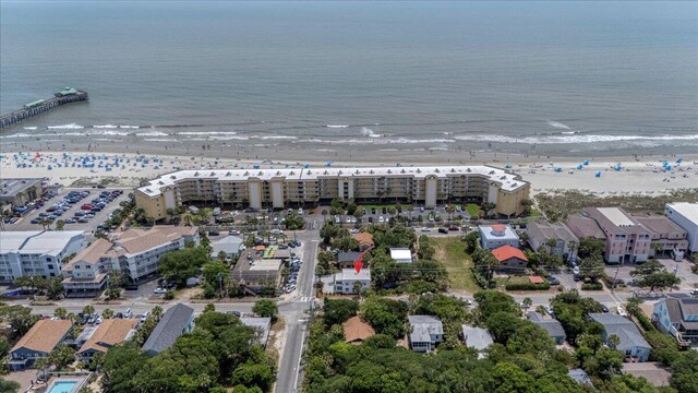 aerial view of property and surrounding area featuring expansive coastline