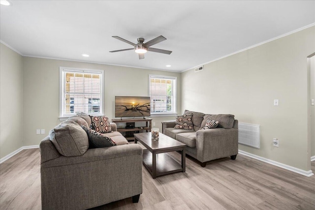 living room with light wood-style floors, crown molding, baseboards, a ceiling fan, and recessed lighting