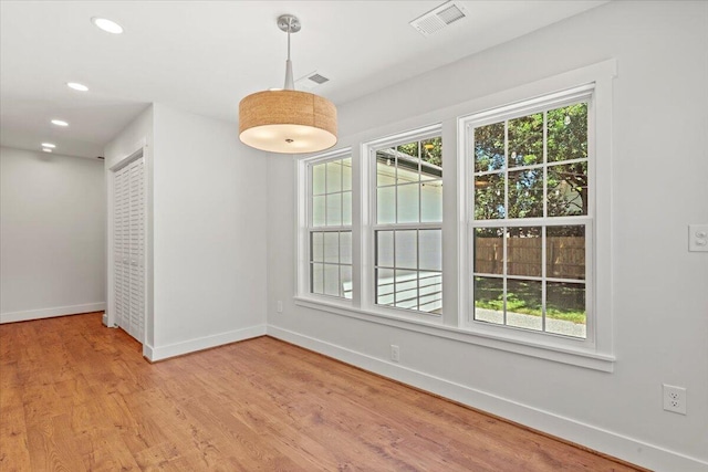 1430 E Montague Ave, North Charleston, SC 29405 - unfurnished dining area with baseboards, light wood-style flooring, and recessed lighting