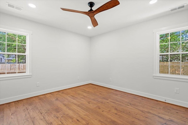 1430 E Montague Ave, North Charleston, SC 29405 - unfurnished room featuring plenty of natural light, baseboards, a ceiling fan, wood finished floors, and recessed lighting