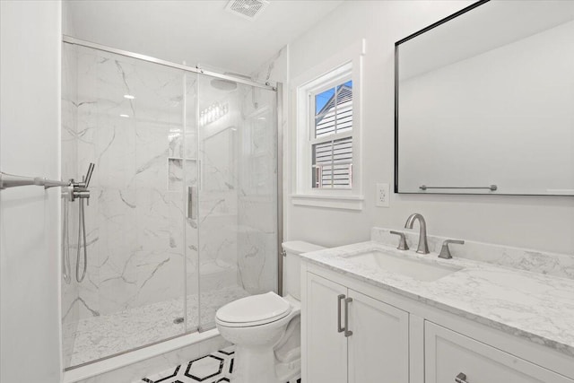 1430 E Montague Ave, North Charleston, SC 29405 - bathroom featuring a marble finish shower, toilet, and vanity