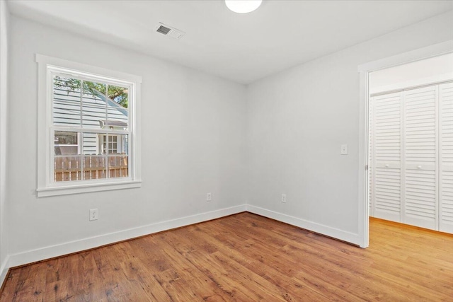 1430 E Montague Ave, North Charleston, SC 29405 - unfurnished bedroom featuring light wood finished floors, baseboards, and a closet