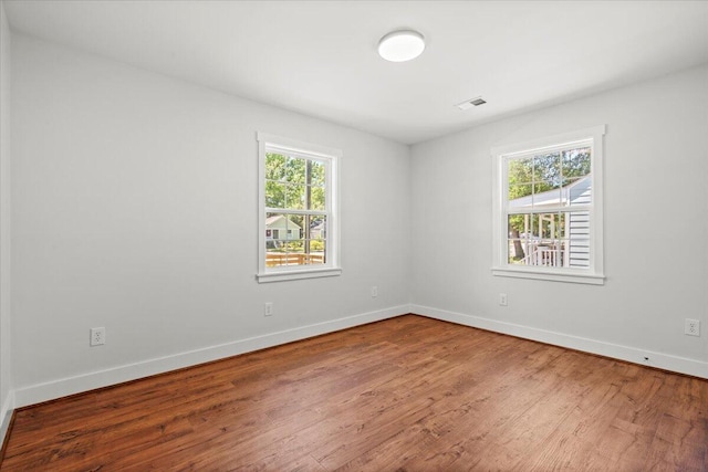 1430 E Montague Ave, North Charleston, SC 29405 - spare room featuring wood finished floors and baseboards
