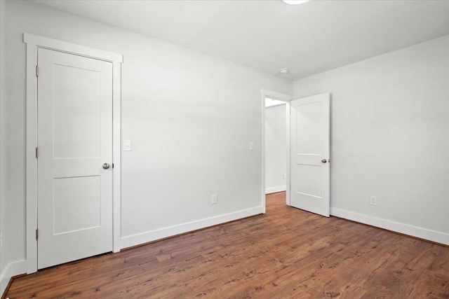 1430 E Montague Ave, North Charleston, SC 29405 - unfurnished bedroom featuring baseboards and wood finished floors