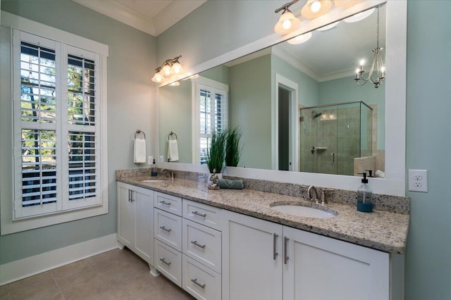 full bath featuring double vanity, a shower stall, ornamental molding, and a sink