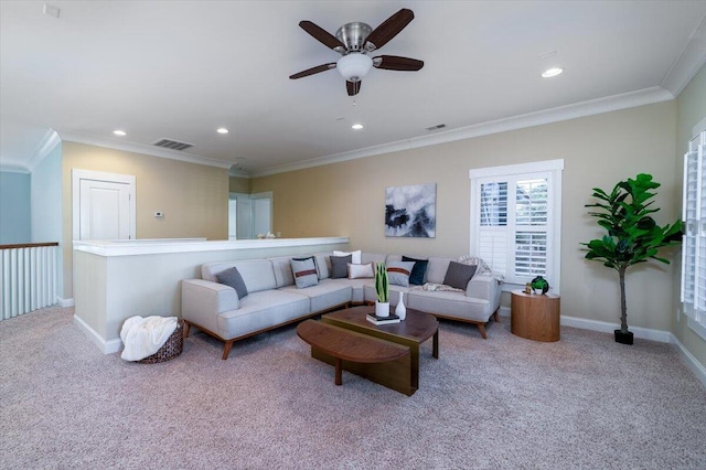 living room featuring baseboards, ornamental molding, visible vents, and light colored carpet