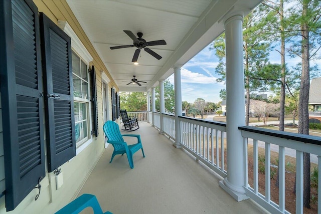 balcony featuring covered porch and ceiling fan