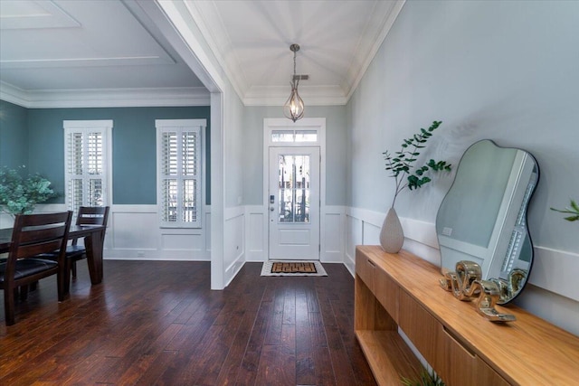 entryway featuring ornamental molding, dark wood-type flooring, and wainscoting