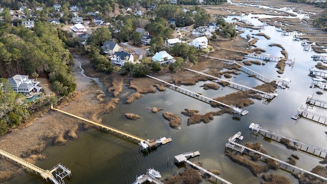 birds eye view of property with a water view and a residential view