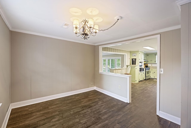 unfurnished room with a chandelier, dark wood-style floors, crown molding, and baseboards