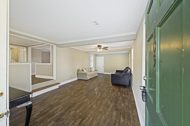 living area featuring dark wood-style floors, baseboards, a ceiling fan, and crown molding