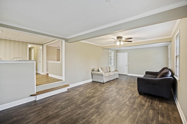 living room with dark wood-type flooring, baseboards, ceiling fan, and ornamental molding