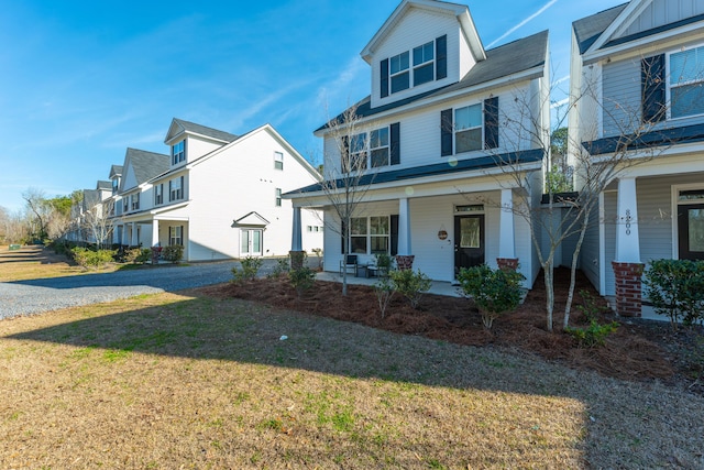 view of front of home featuring a front lawn and a porch