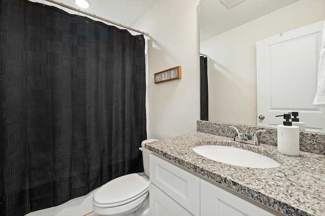 bathroom with toilet and vanity