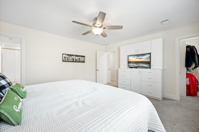 bedroom featuring light carpet and ceiling fan