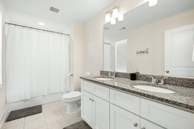 full bathroom featuring toilet, tile patterned flooring, shower / bath combo, and vanity