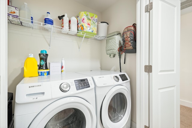 laundry area with carpet and washer and clothes dryer