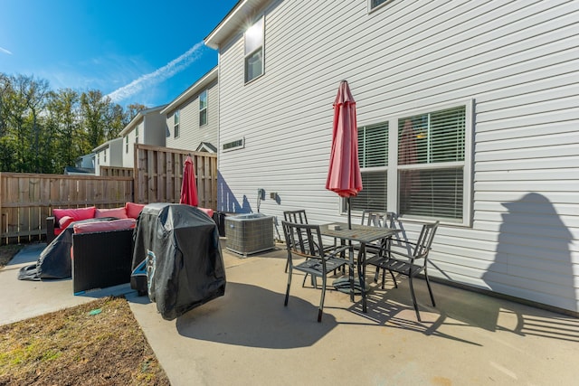 view of patio with central AC and a grill