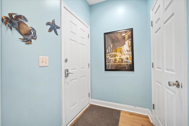 216 W Arctic Ave Unit 9, Folly Beach, SC 29439 - entryway featuring light wood finished floors and baseboards