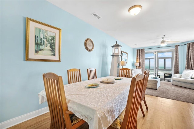 216 W Arctic Ave Unit 9, Folly Beach, SC 29439 - dining area with ceiling fan, baseboards, and light wood-style floors