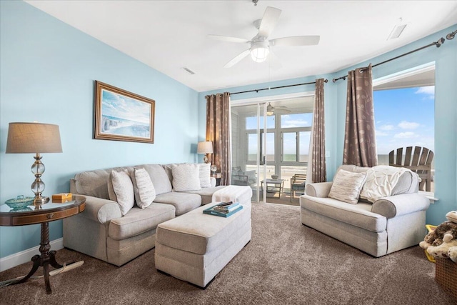 216 W Arctic Ave Unit 9, Folly Beach, SC 29439 - carpeted living area with ceiling fan and baseboards