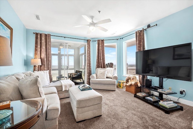 216 W Arctic Ave Unit 9, Folly Beach, SC 29439 - carpeted living room with a ceiling fan and baseboards