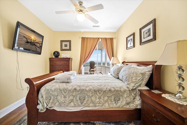 216 W Arctic Ave Unit 9, Folly Beach, SC 29439 - bedroom with baseboards, wood finished floors, access to outside, and ceiling fan