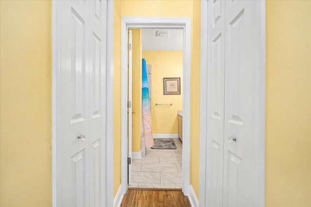 216 W Arctic Ave Unit 9, Folly Beach, SC 29439 - hallway with baseboards