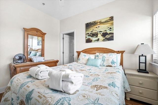 216 W Arctic Ave Unit 9, Folly Beach, SC 29439 - bedroom with wood finished floors and multiple windows