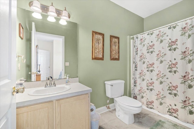 216 W Arctic Ave Unit 9, Folly Beach, SC 29439 - full bath featuring toilet, vanity, a shower with curtain, and baseboards