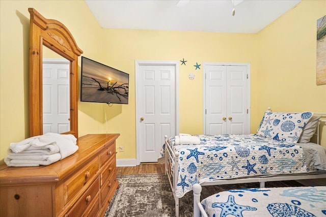 216 W Arctic Ave Unit 9, Folly Beach, SC 29439 - bedroom with wood finished floors, baseboards, a closet, and ceiling fan