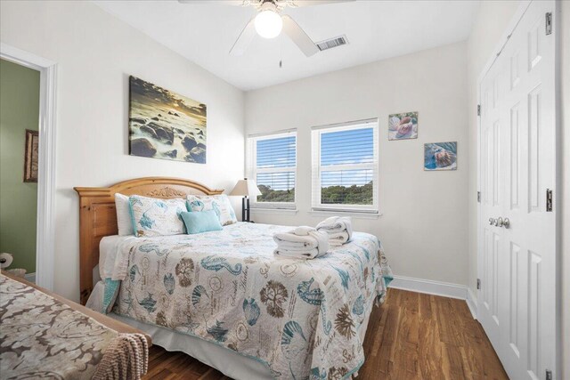 216 W Arctic Ave Unit 9, Folly Beach, SC 29439 - bedroom with baseboards, a closet, wood finished floors, and a ceiling fan