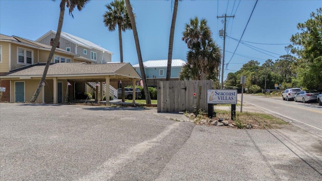 216 W Arctic Ave Unit 9, Folly Beach, SC 29439 - view of asphalt street with stairs and traffic signs